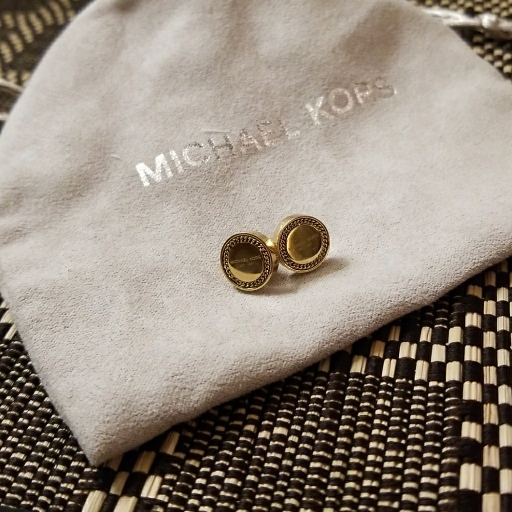 Michael Kors gold stud earing.